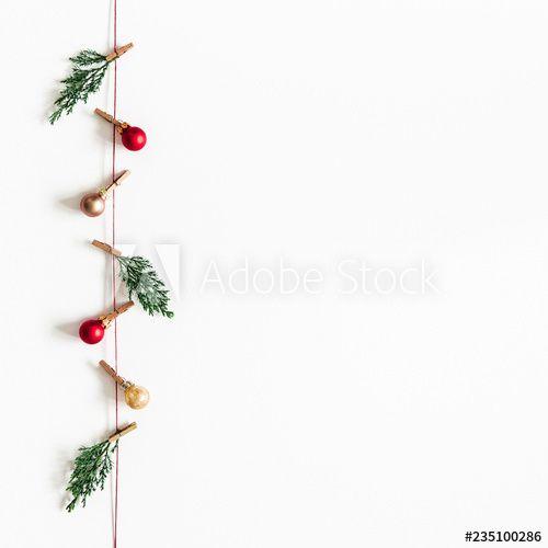 Red Square with White Tree Logo - Christmas composition. Garland made of red and golden balls, fir ...