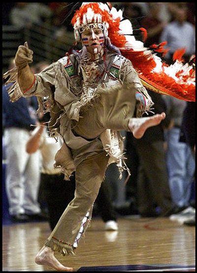Chief Basketball Logo - Left: 'Chief Illiniwek' performs at a basketball game at the ...