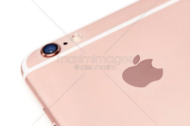 Rose Gold Apple Logo - Photo: Apple logo on rose gold iPhone 6s closeup | MaximImages Stock ...