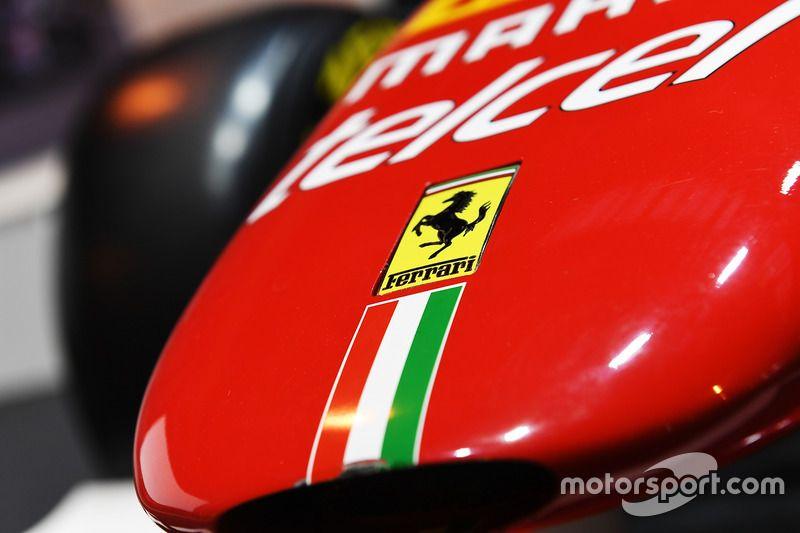 Ferrari 2017 Logo - A Ferrari logo on a car in the F1 Racing display at Autosport