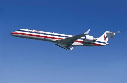 Small American Airlines Logo - American and United Switch to Small Planes for Big Routes - CBS News