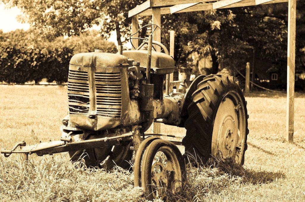 Vintage Farm Equipment Logo - Vintage farm equipment. One of many retired old farm tracto