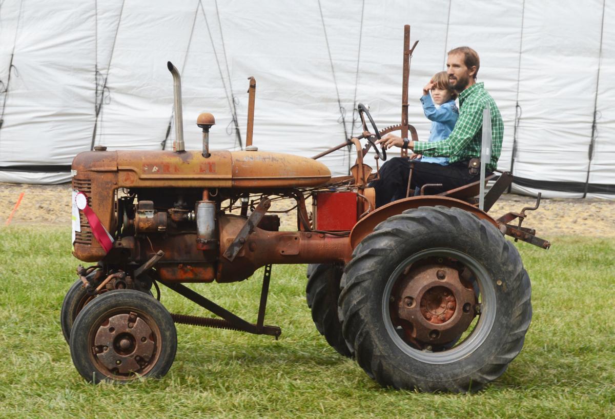 Vintage Farm Equipment Logo - Vintage farm equipment on display at the 35th annual Threshing Bee