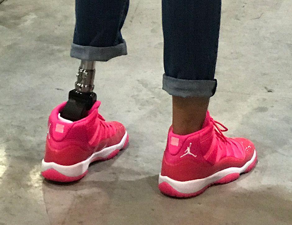 Hot Pink Jordan Logo - Jordan Brand Paralympic Sprinter Wears Hot Pink Air Jordan 11s