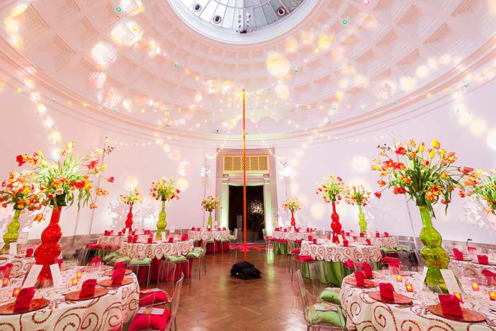 Red White Gold Yellow Flower Logo - The Rotunda had a Mexican-themed look with white and gold linens ...