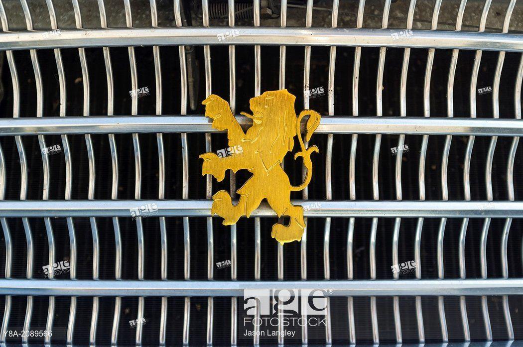 Vintage Automobile Logo - Peugeot logo, gold lion emblem from a 1973 Peugeot 404 diesel ...