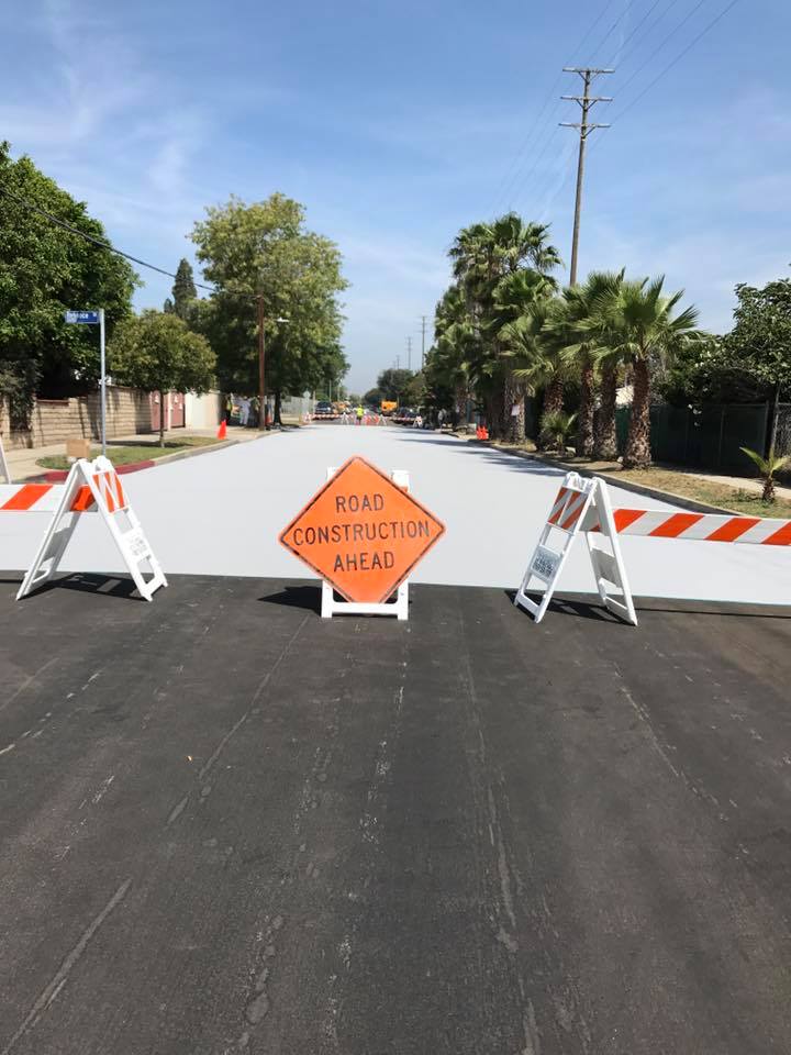 Orange and White Road Logo - Los Angeles is painting their roads white to cool the city down