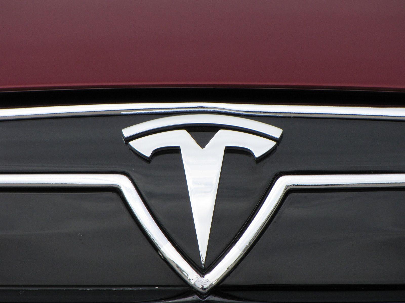 Tesla Car Logo - What the Tesla logo means: CEO Elon Musk explains