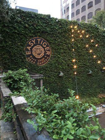 Landscape Wall Logo - Logo on Ivy wall by river - Picture of Easy Tiger, Austin - TripAdvisor