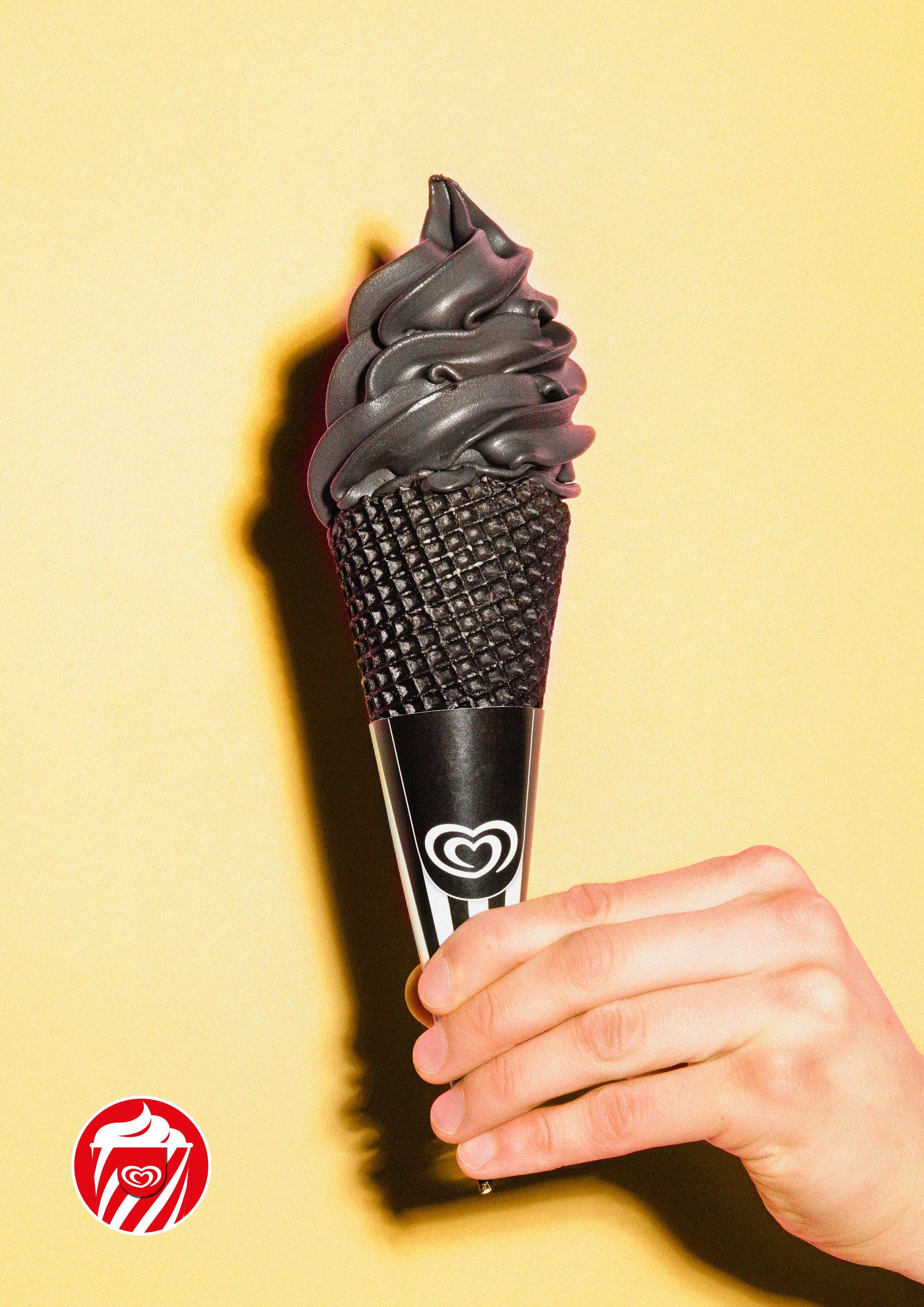 Yellow and Black Swirl Logo - Frozen blackout: Swirl's brings black ice cream to the Netherlands