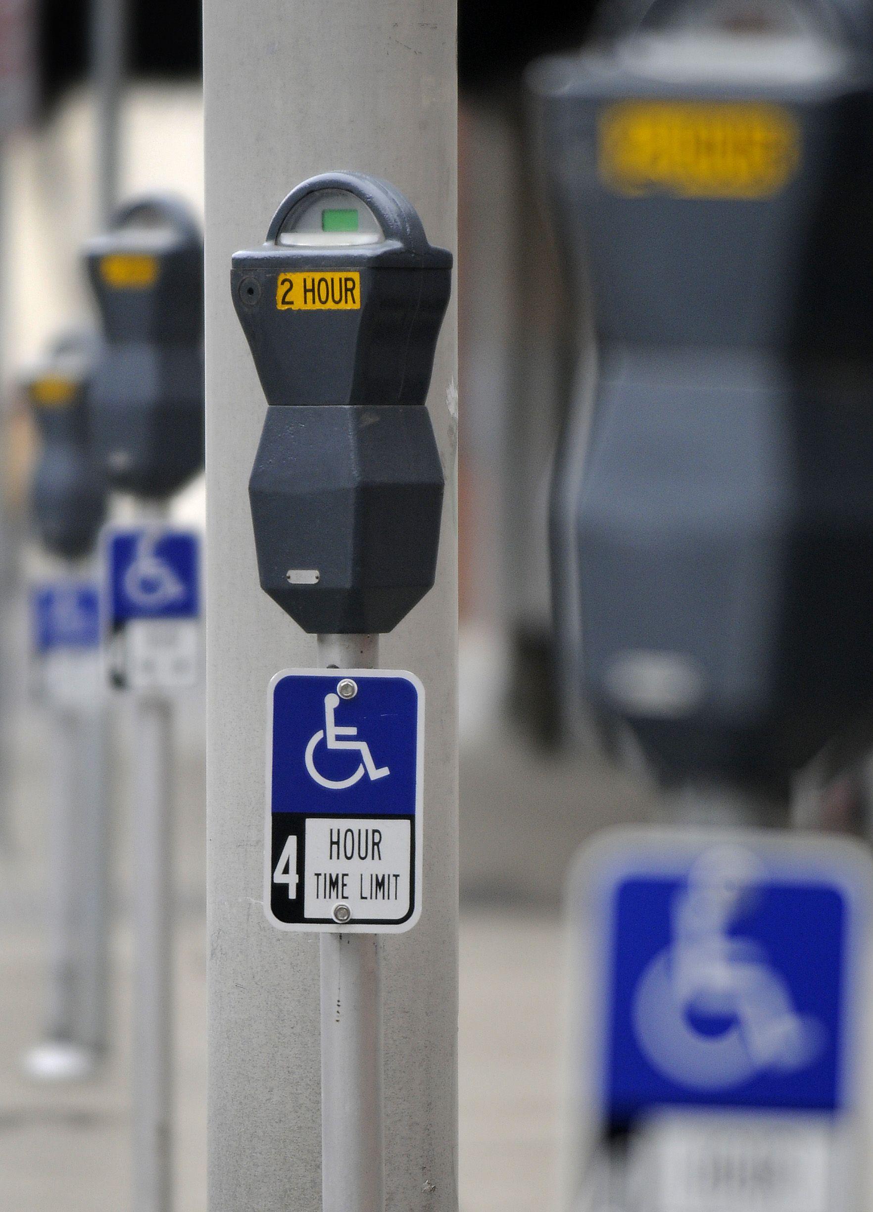 Grey and Blue Handicap Logo - New parking signs confuse some motorists | The Spokesman-Review