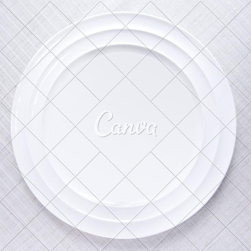 Empty Oval Logo - Empty White Plate on Tablecloth - Photos by Canva