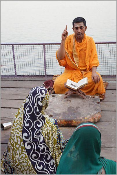 Hinduism Brahmin Logo - A brahmin priest reading a Hindu text near Ganges