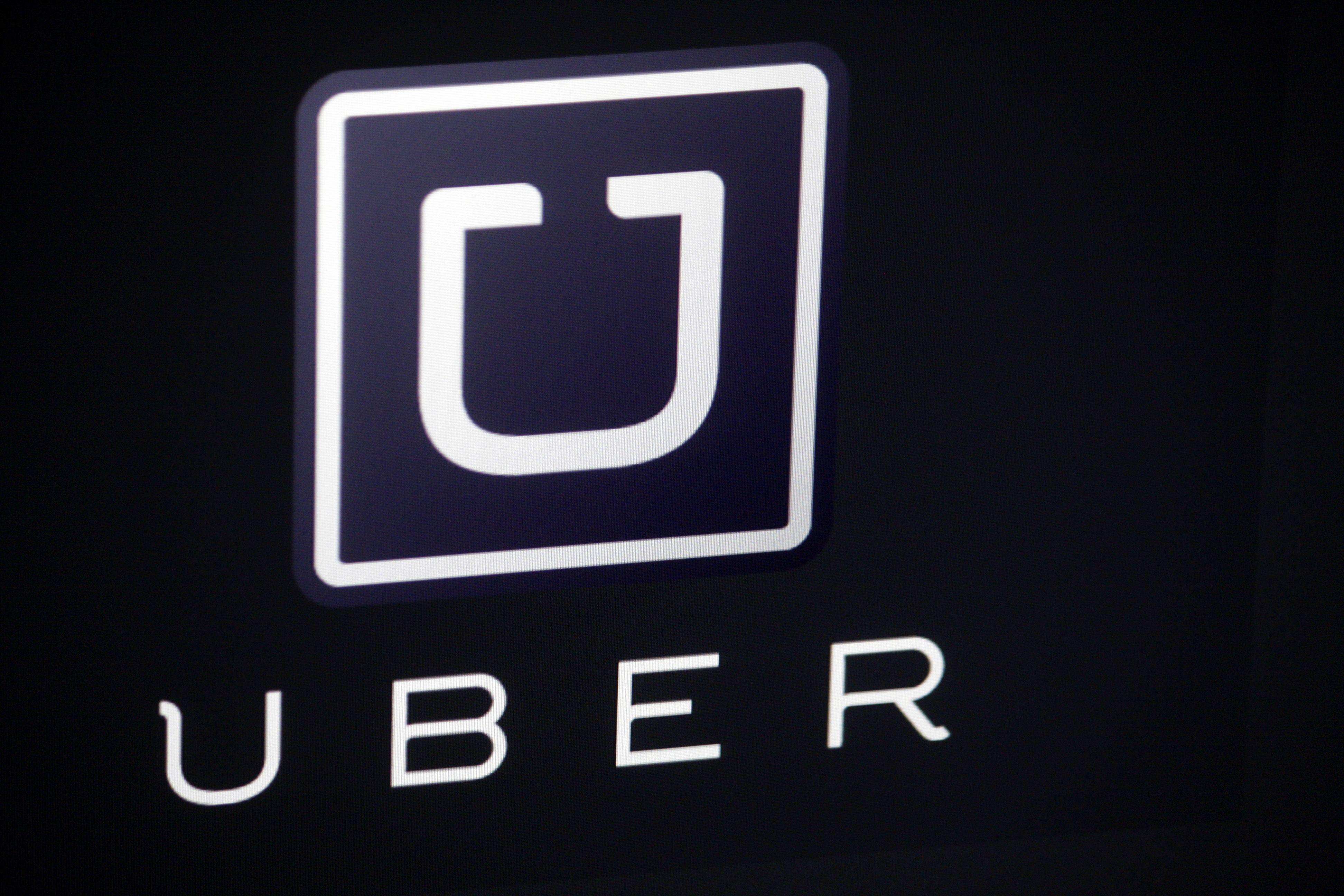 Uber Big Logo - Burner phones and canceled rides: How Uber steals drivers from Lyft