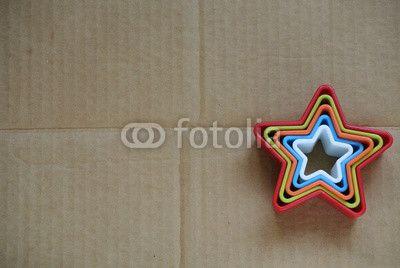 Multicolored Star Logo - multicolored forms for a cookie in the form of a star on a cardboard ...