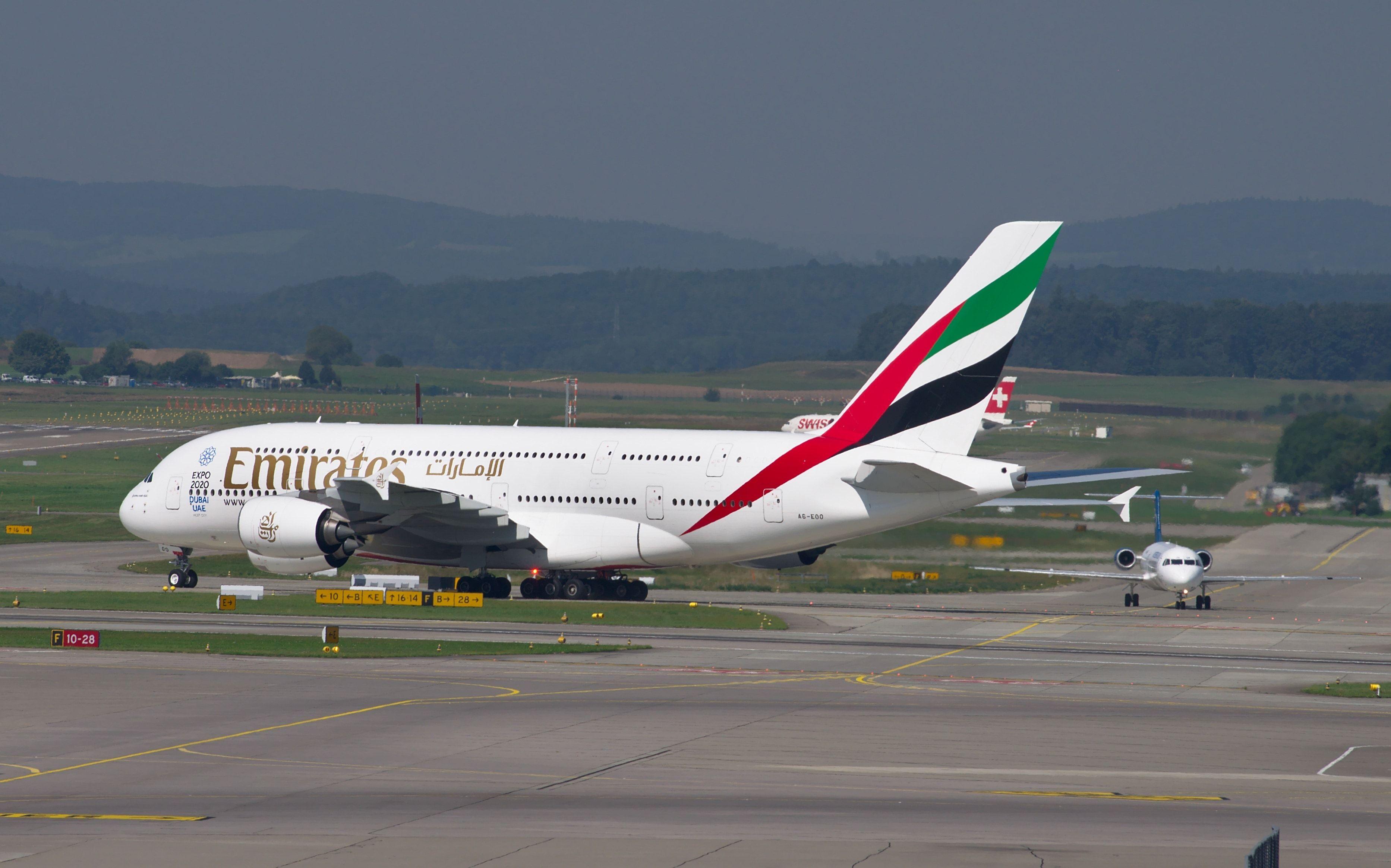 A Green and Red Airline Logo - white green red and black emirates airplane free image