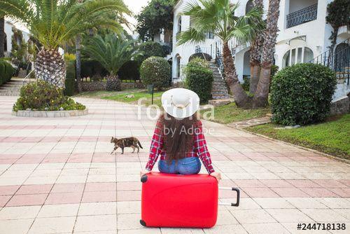 Red People Sitting Back to Back Logo - Travel, holidays and people concept - young woman sitting on red ...
