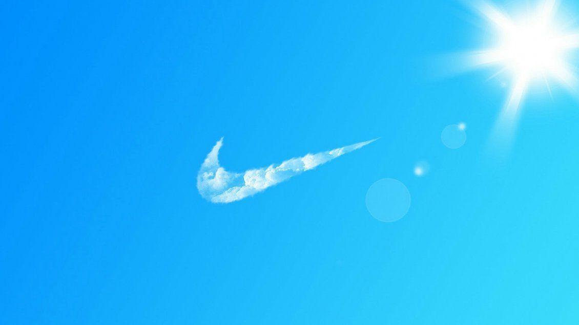 Blue Nike Logo - Nike logo by clouds on the blue sky