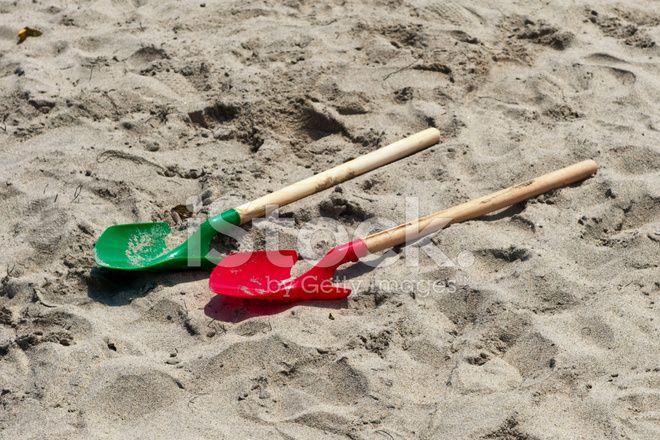 Red and Green Shovel Logo - Toy Beach Shovels Lying on The Sand, Red and Green Stock Photos ...