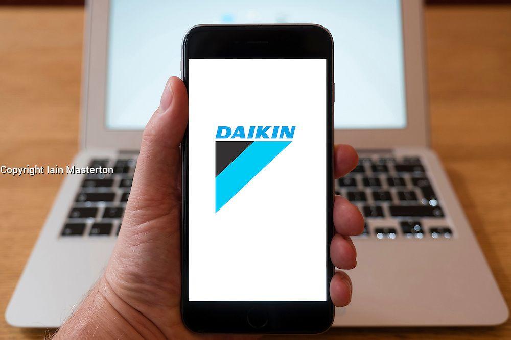 Multinational Mobile Phone Manufacturer Logo - Using iPhone smartphone to display logo of Daikin , Japanese ...