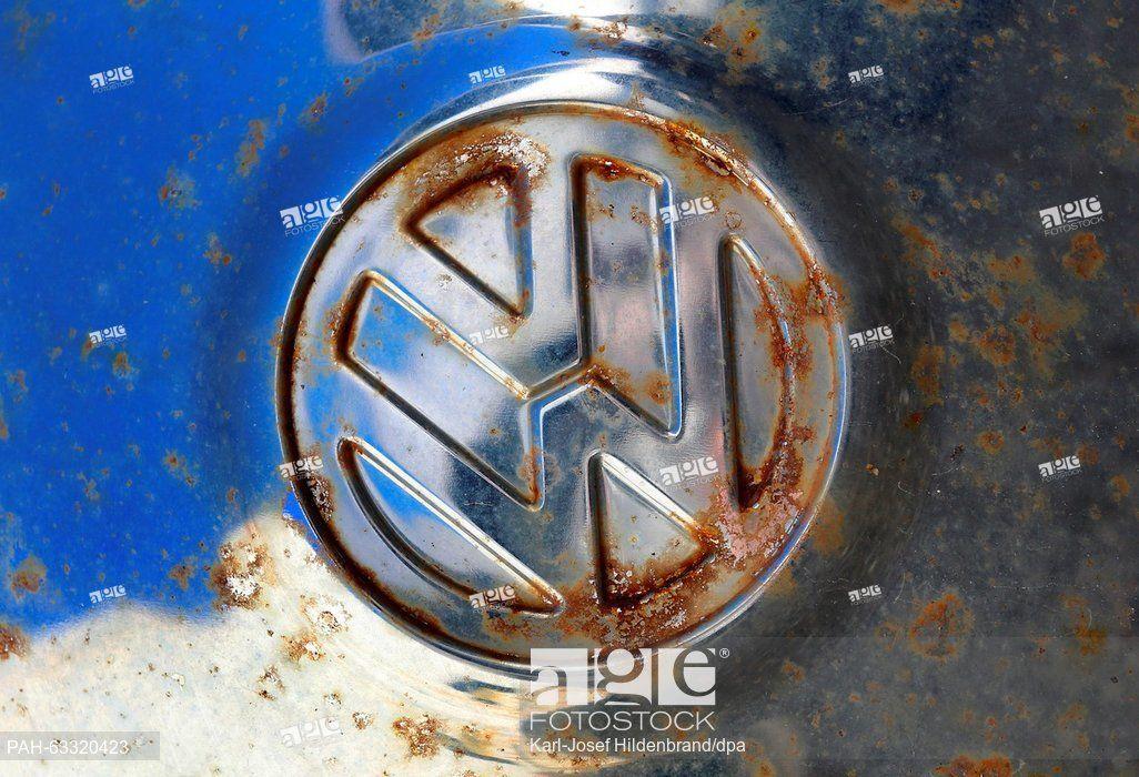 Old VW Logo - A rusty VW Logo on the hubcap of an old VW Beetle at a garage in ...