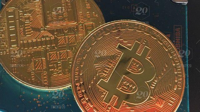 Gold Bitcoin Logo - Close up on gold bitcoin cryptocurrency, blockchain, bitcoin mining