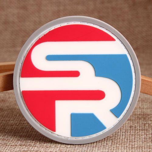 Red with White R Inside Circle Logo - 的 SR PVC Patch is a round PVC patch consisting mainly of red