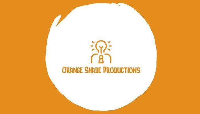 Deer in an Orange Circle Logo - Deer Shed Festival 10 friendly music, arts and science