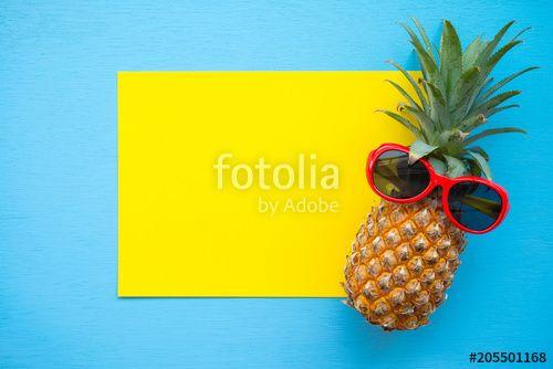 Red Blue Pineapple Logo - Flat lay of pineapple with red sunglasses on yellow and blue ...